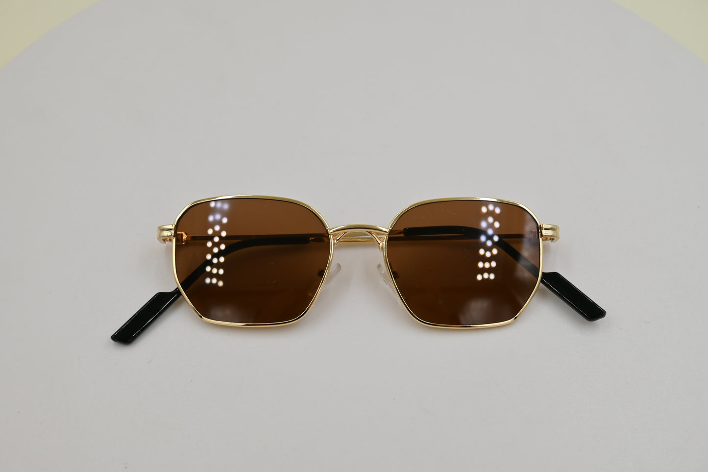 Lentes hexagonal en café